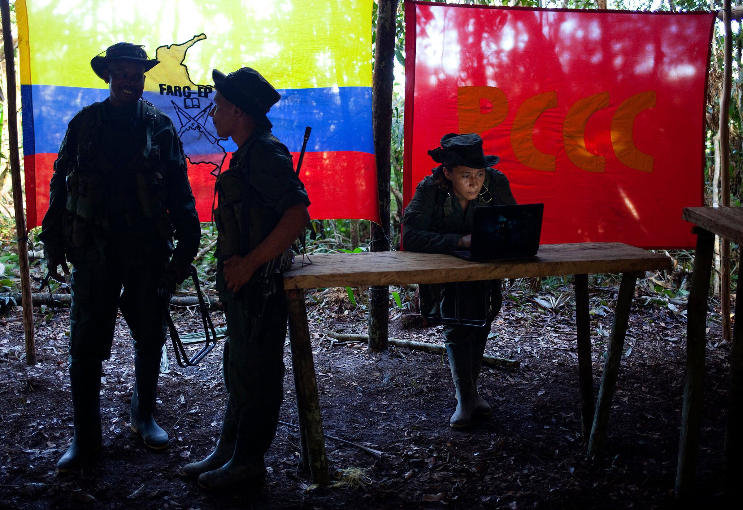 FARC rebels meet in a rebel camp in in Colombia in May 2016. Climate and environmental scientists are raising questions about how the peace process may impact forests that were previously undevelopable because of the rebel presence. (Reuters/Eliana Aponte) 