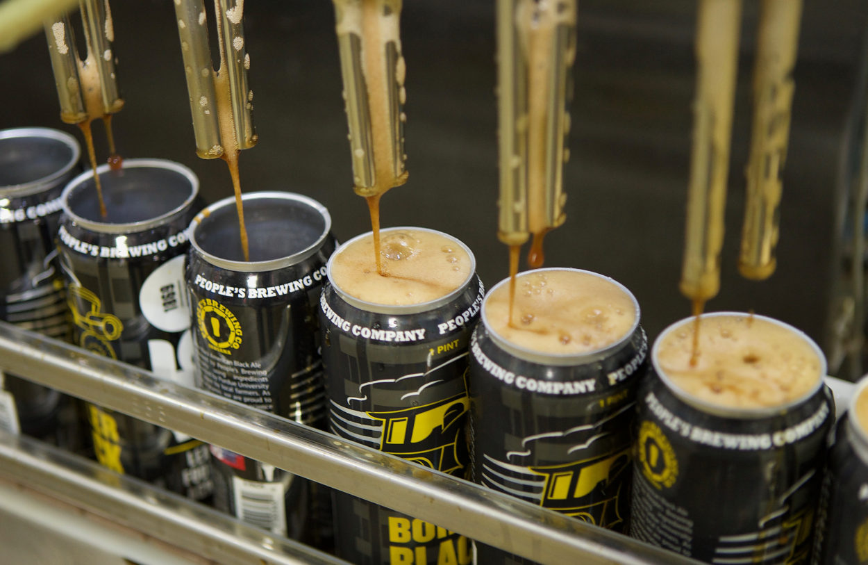 cans of beer being filled 