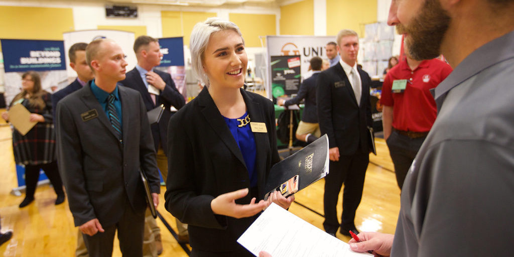 young woman talking to a recruiter 