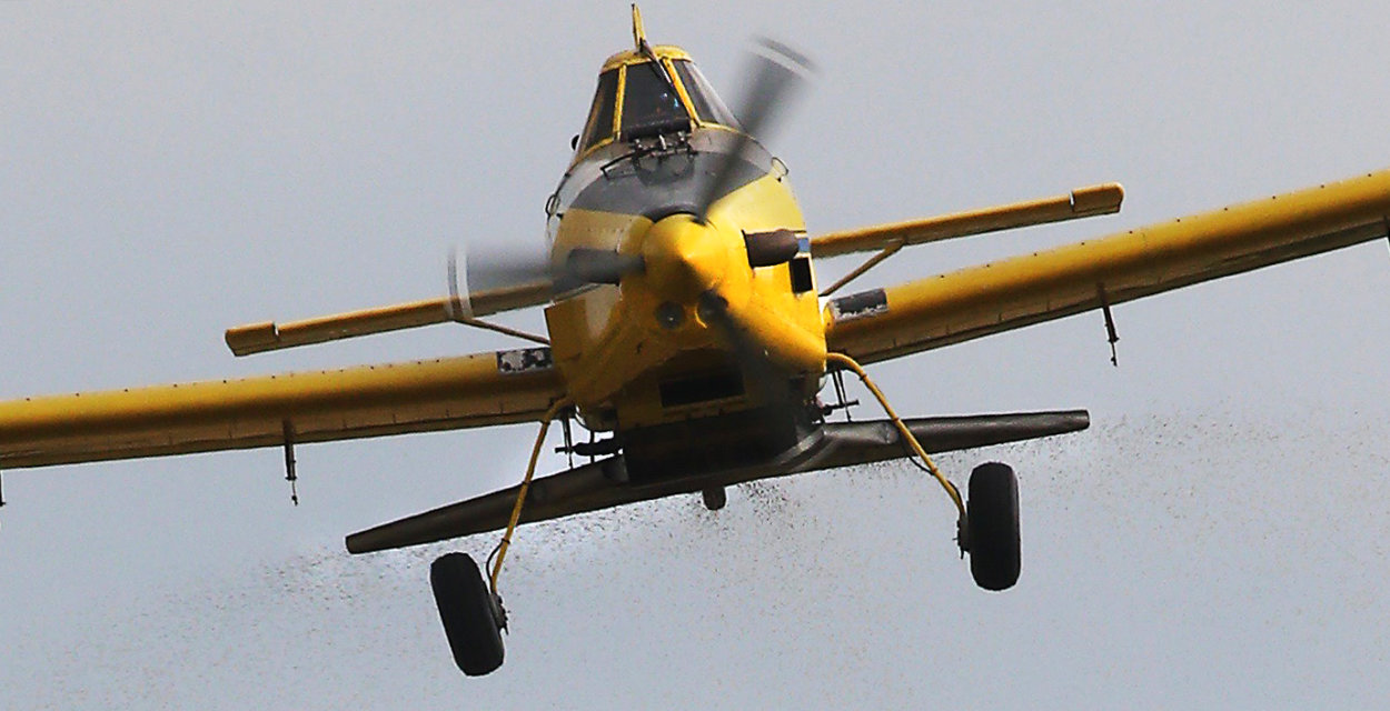 airplaing droping soybeans