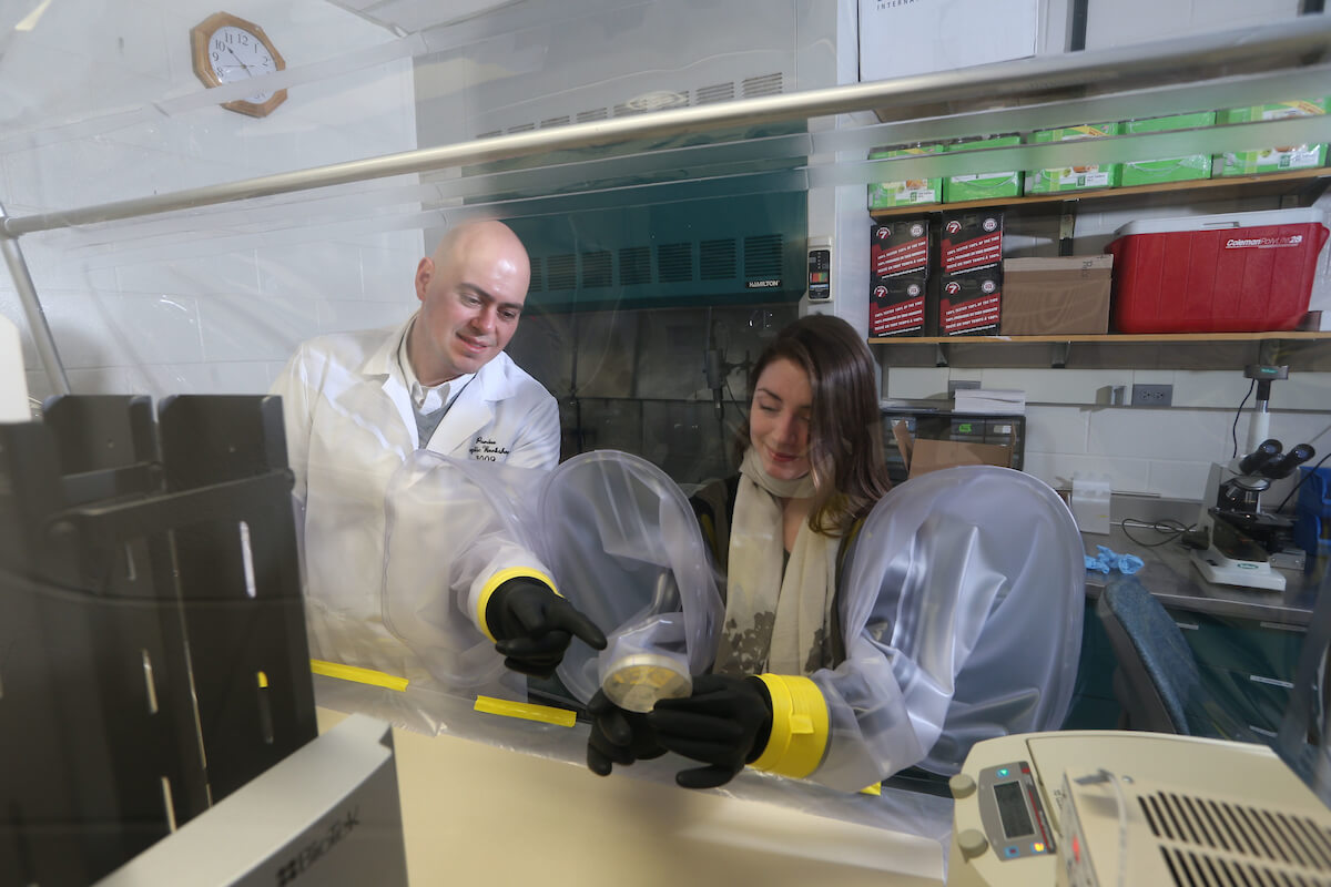 Professor and student working on a lab