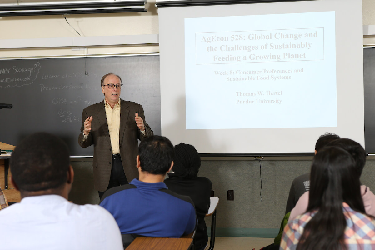 Thomas Hertel talking to a class