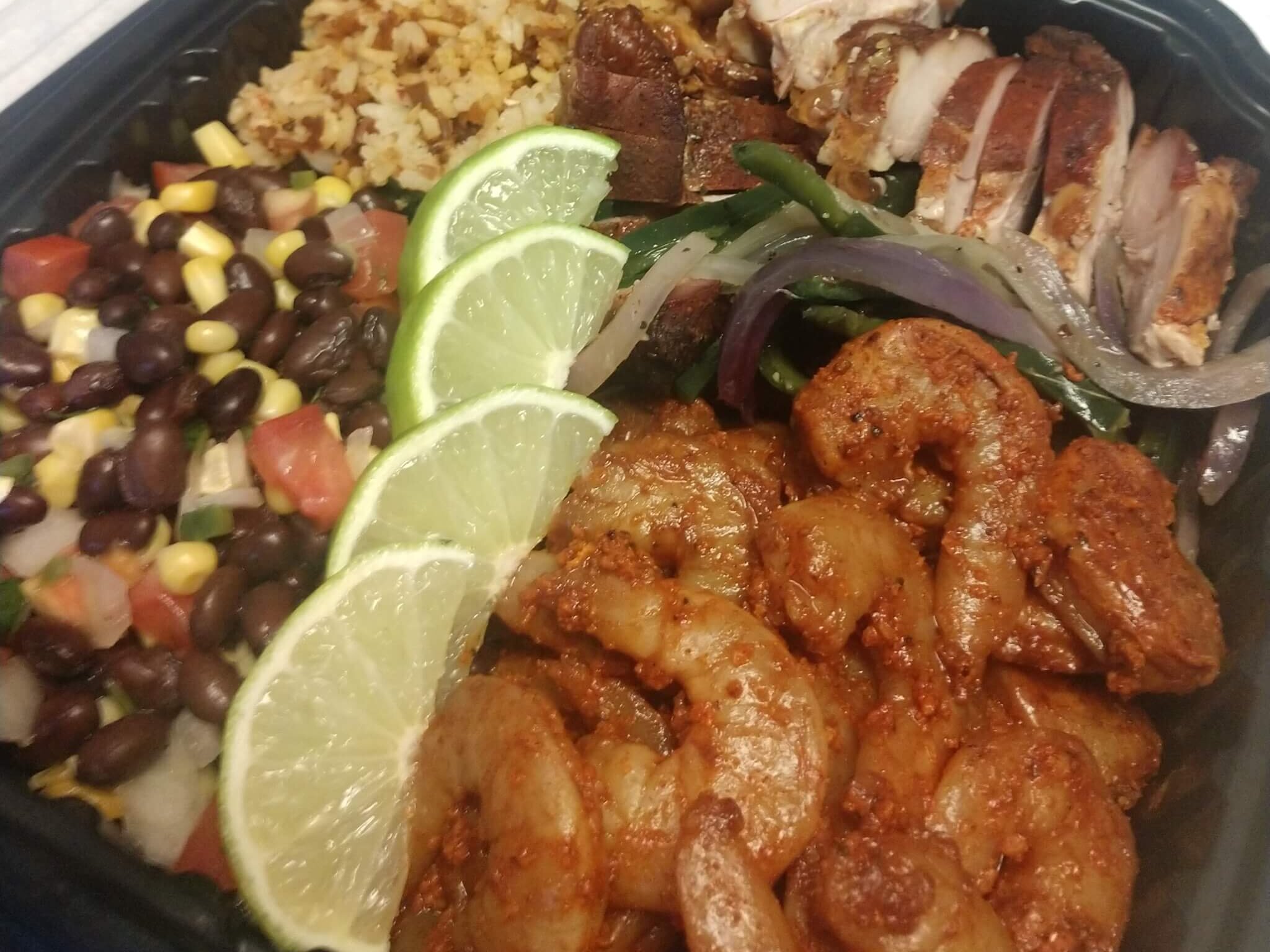 Cinco de mayo menu option, shrimp, rice and vegetables arrange in a plate 