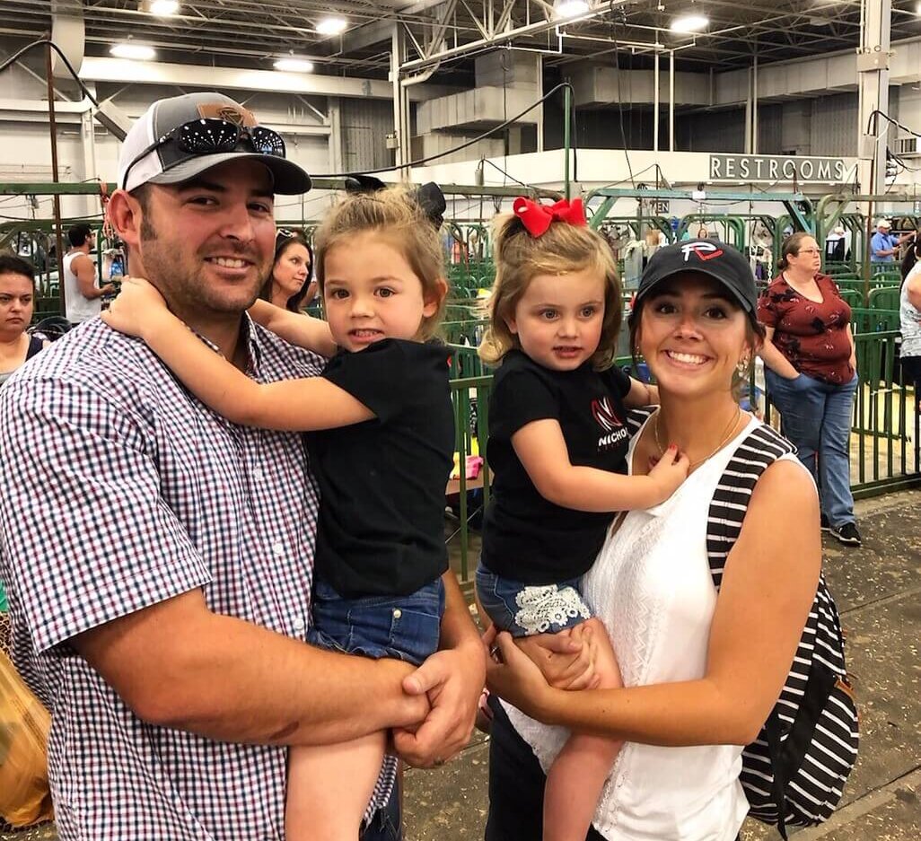 Woody and Kayla Nichols with their daughters at animal fair