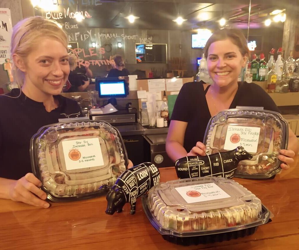 Girls showing icehouse boxes