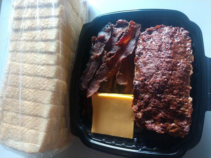 meatloaf sandwich kit box, displaying bread, big portion of meat, bacon and slices of cheese