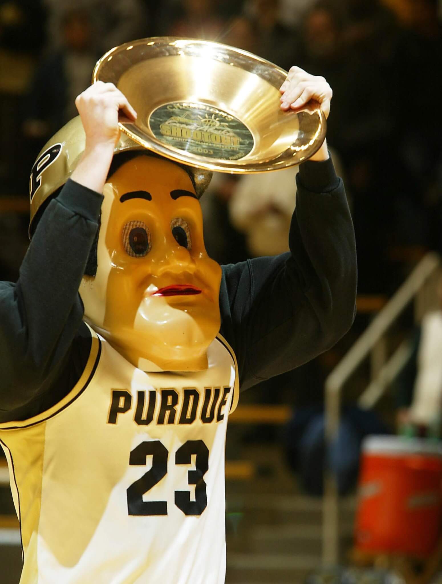 Andy Fordice, shown displaying Purdue's 2003 Great Alaska Shootout trophy to the Mackey Arena crowd, earned a spot in ESPN's Top 10 Plays of the Day when he crowd surfed across the court on a wave of Purdue fans. (Photo by Tom Campbell)