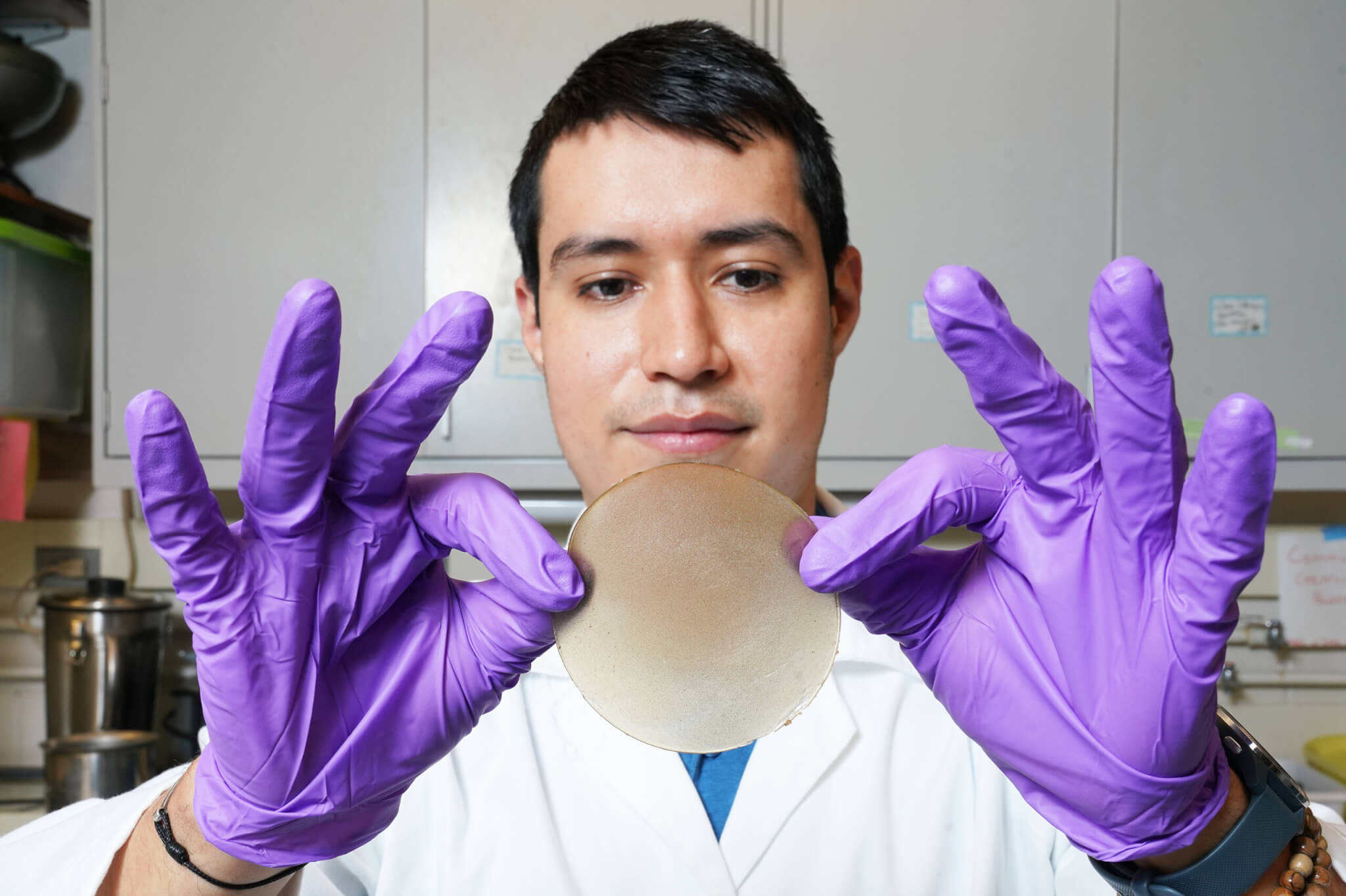 Uriel Urbizo Reyes, Graduate Research Assistant in Food Science, holds biofilm made from mucilage, a by-product of processing chia seeds. (Photo by Tom Campbell)