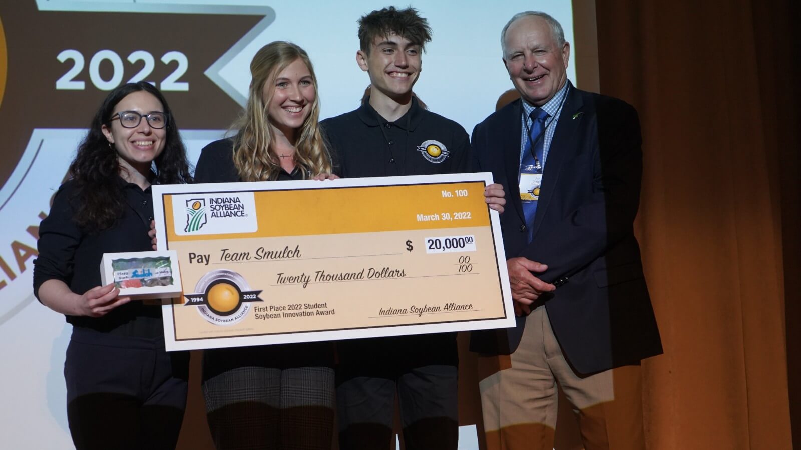 From left Zuhal Cakir, Elizabeth Plassard and Ethan Miller of "Team Smulch" are presented with their grand prize check from Jim Douglas; Indiana Soybean Alliance Chairman and farmer from Flatrock, IN.