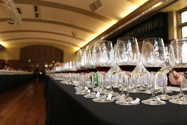A row of wine glasses stand on a table in the Purdue Memorial Union Ball Rooms.