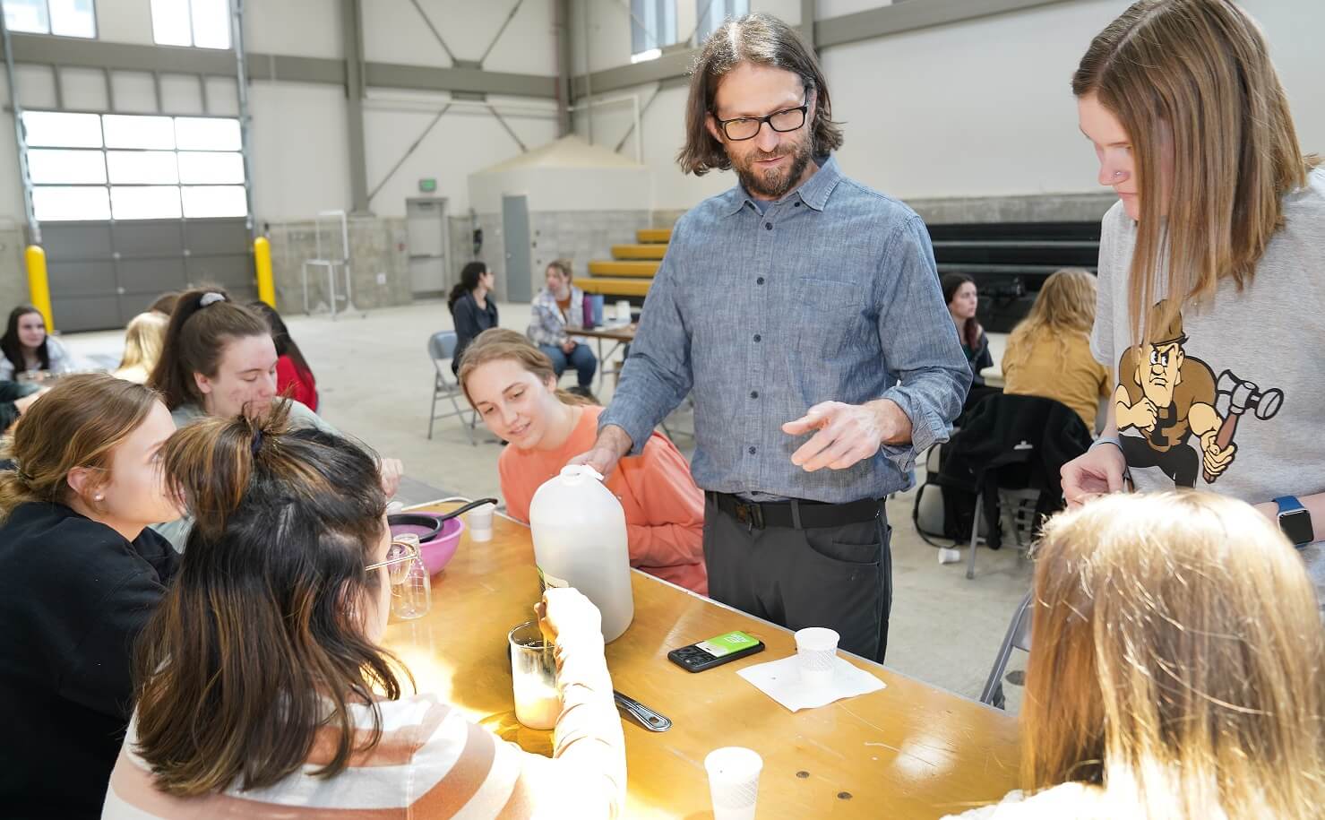 Paul Ebner works with Purdue students to make yogurt, photo by Tom Campbell