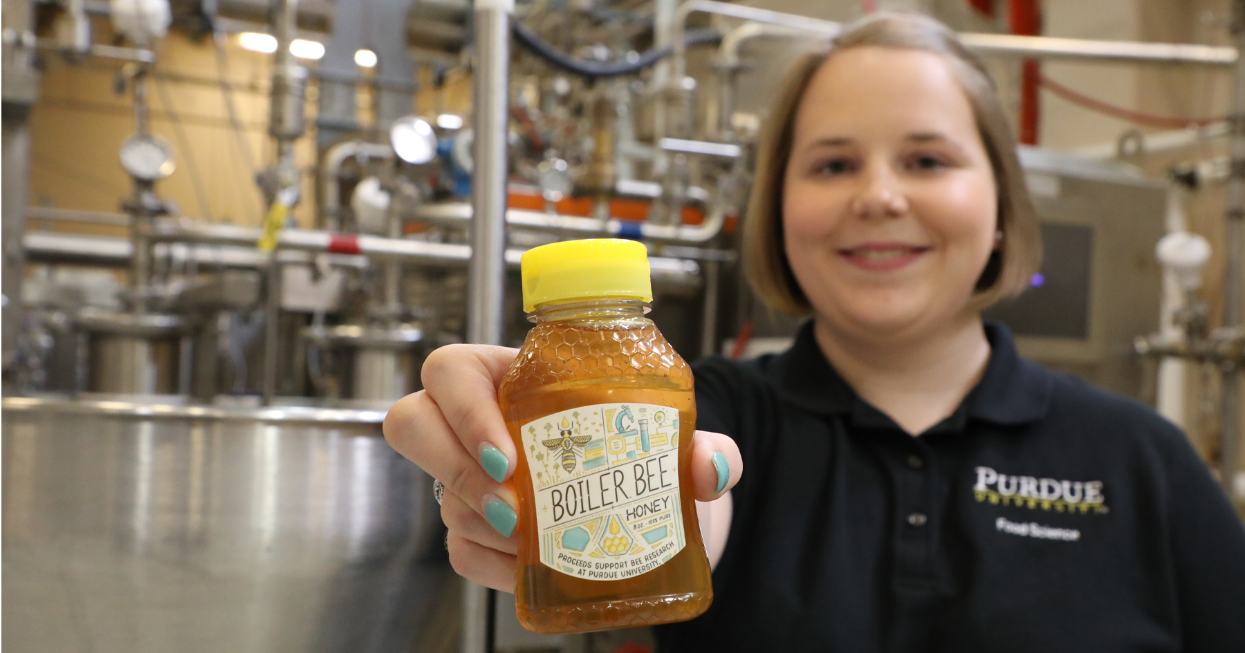 Alyson McGovern holds a bottle of Boiler Bee Honey.