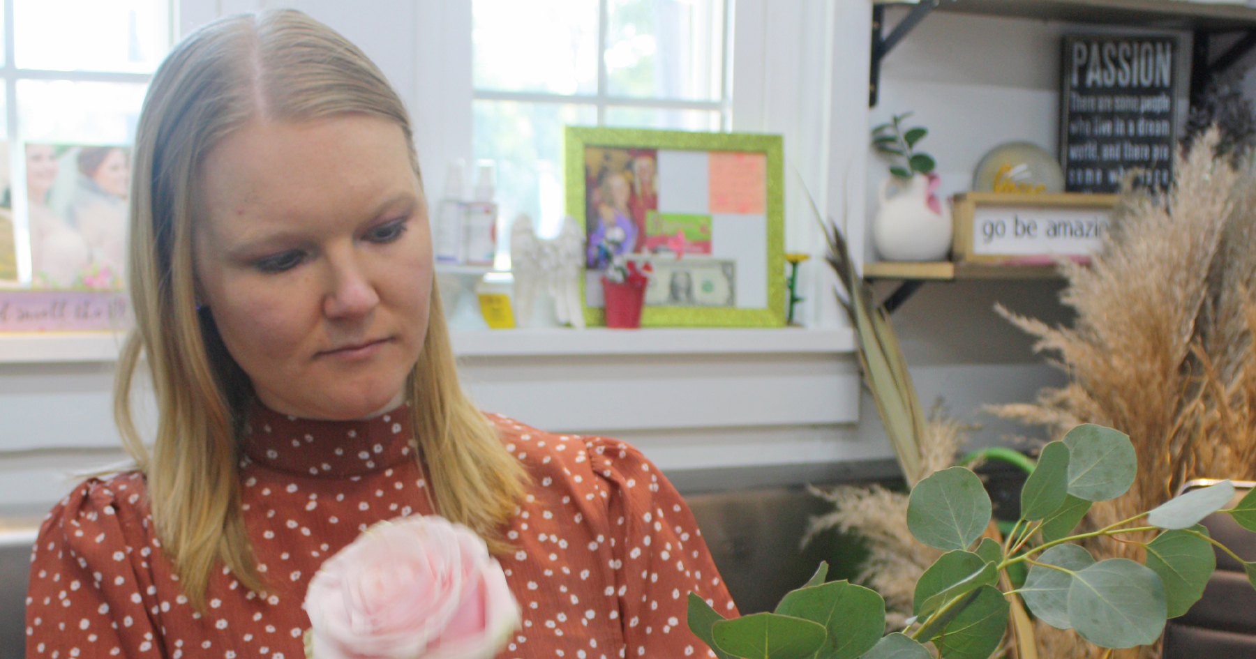 Josi Lambert working on a flower arrangement