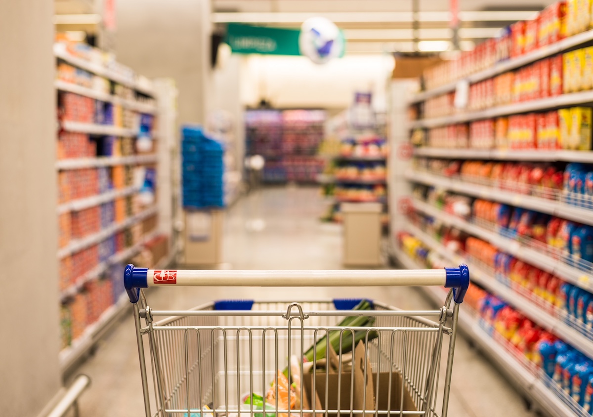 a cart in a grocery aisle 