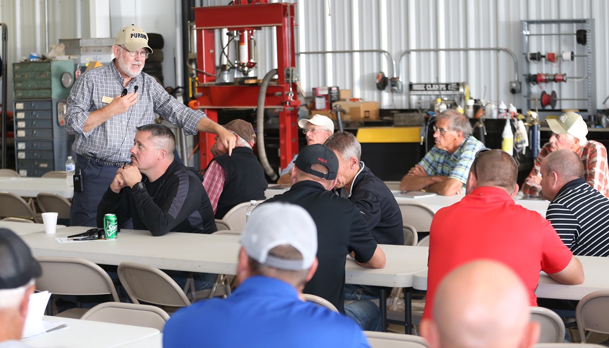 Bob Nielsen, Purdue Extension Corn Specialist teaching a group 