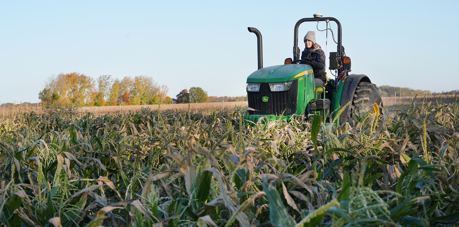 Grad student Chloe Richard on a tractor. 