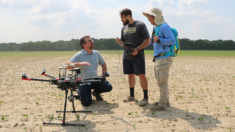 Keith Cherkauer, Michael Montgomery standing by drone 
