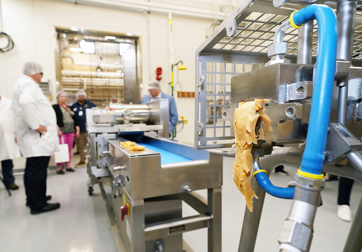 The new Coperion extruder processes a product as an example of the facility's new capabilities.