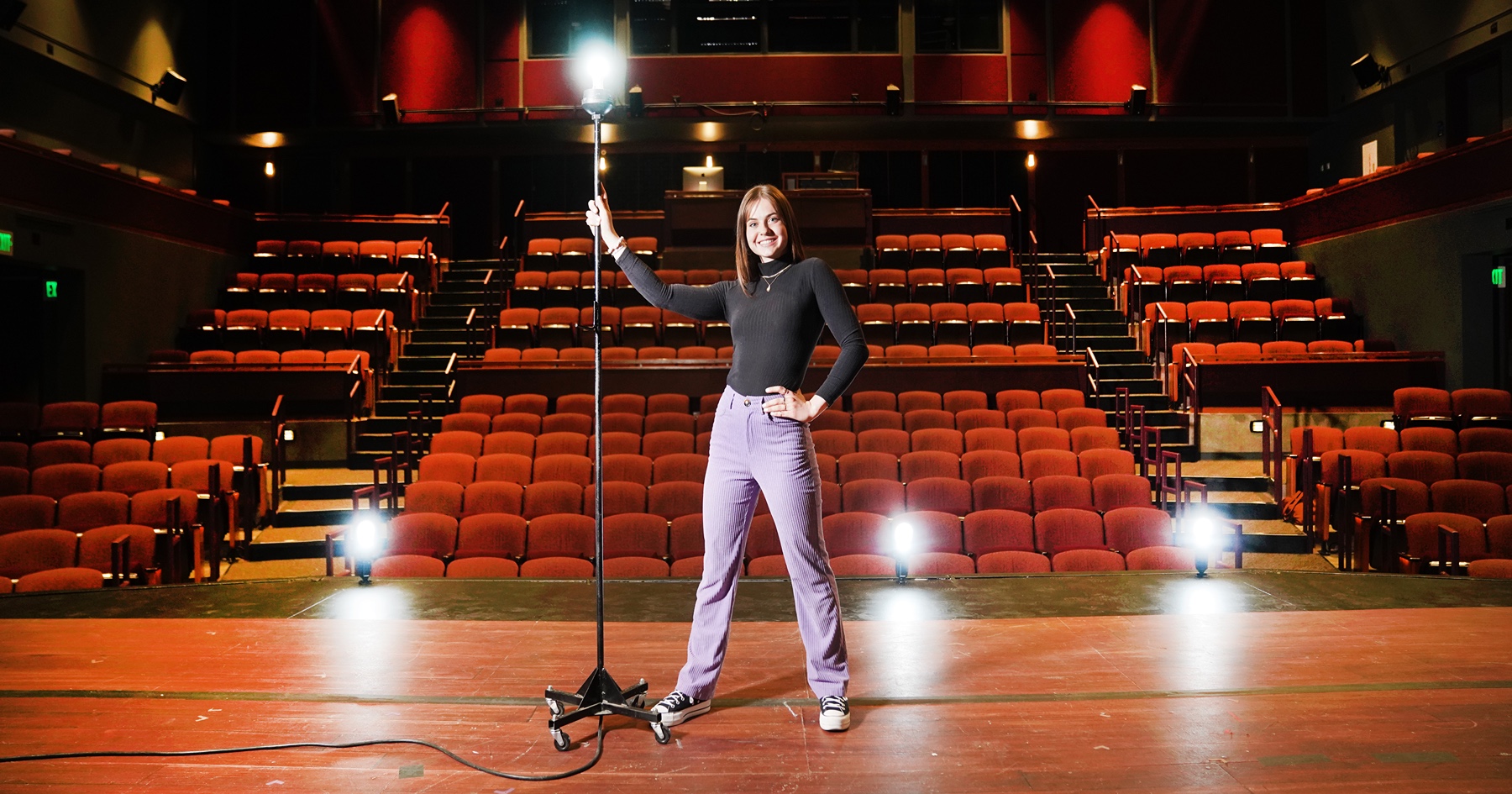 Renee Bippus stands on stage at Purdue