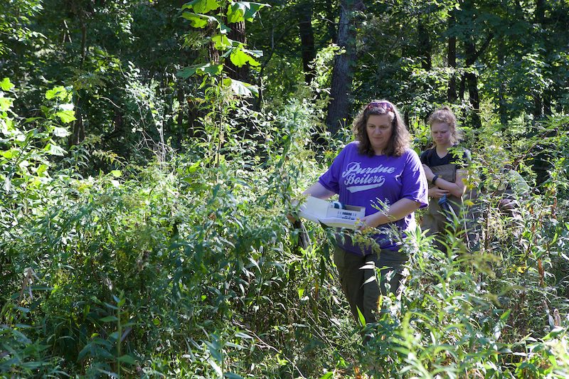Linda Prokopy walks with a student in Martell Forest.