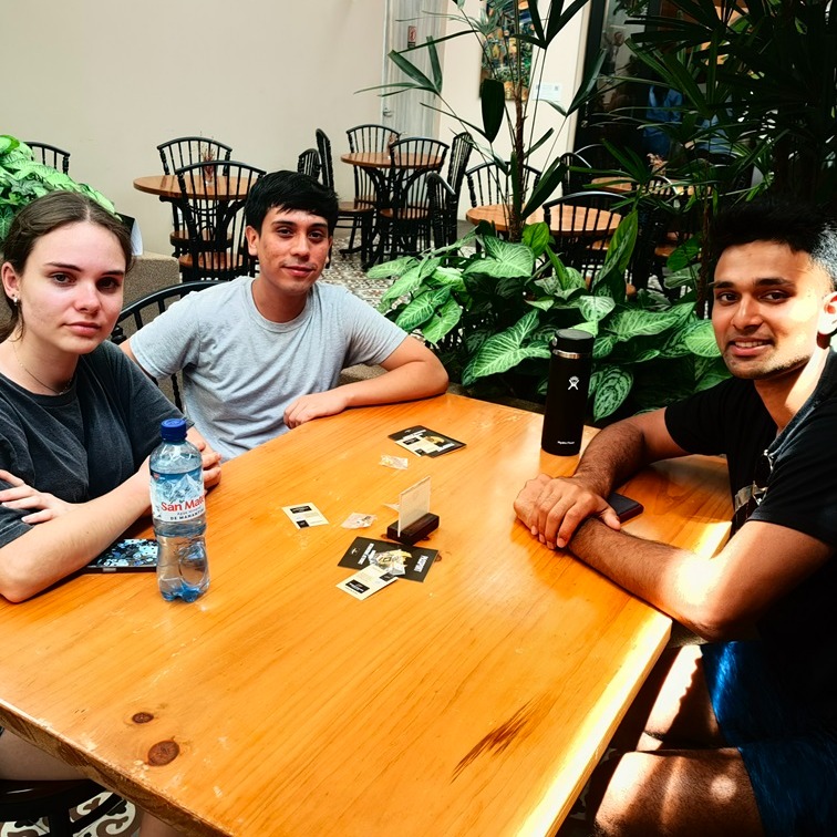 Students sitting around wood table