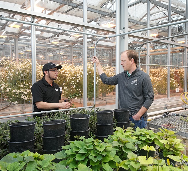 meyers-and-carlos-in-greenhouse.jpg