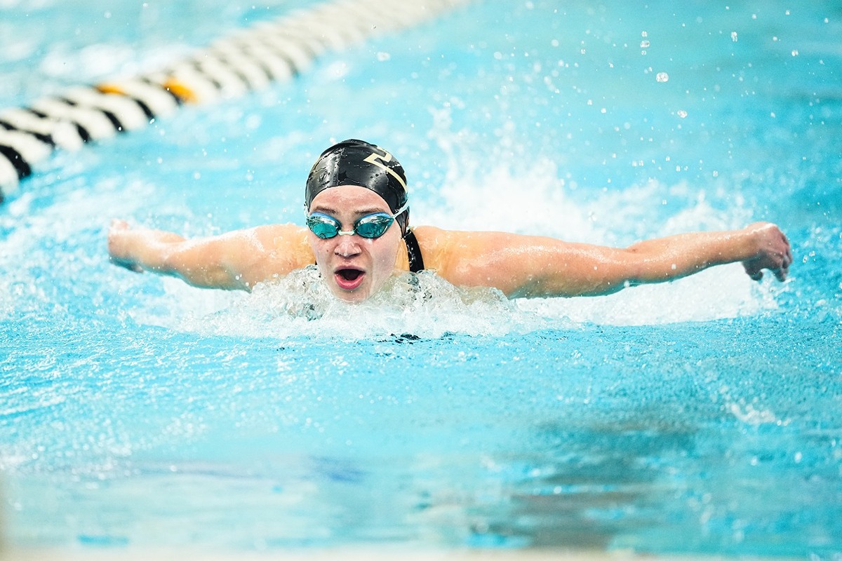 Evie Sierra, Academic All Bug Ten Honoree, competes in women's swimming and diving competition.