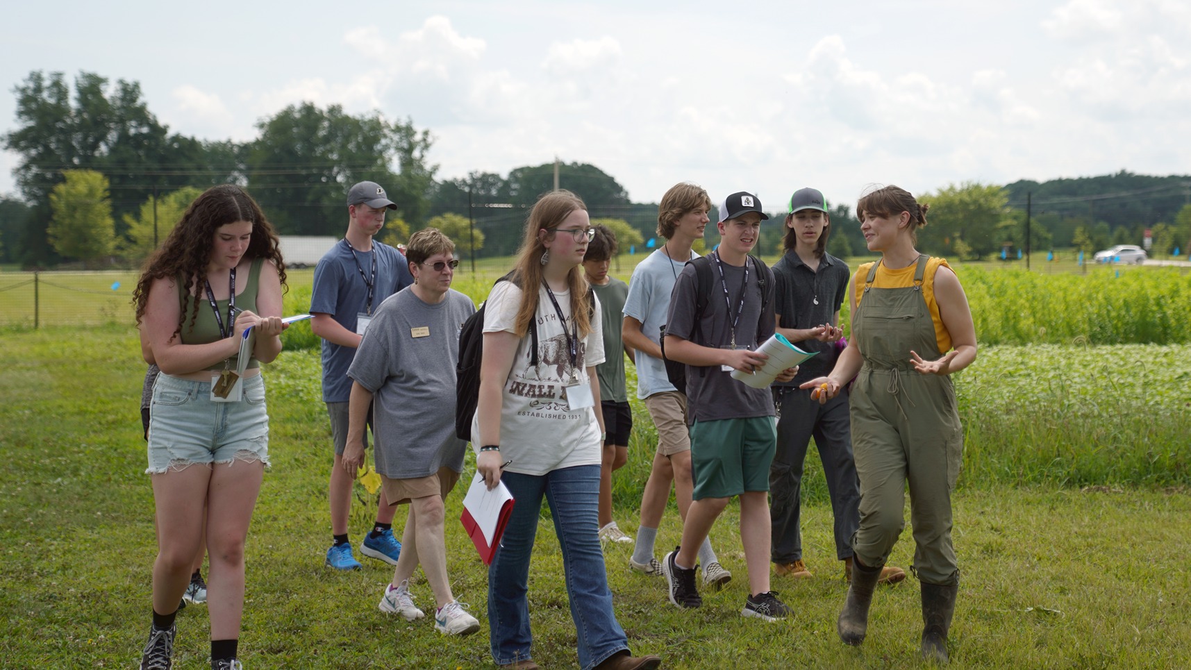 Students walking through the Purdue Student Farm on a tour