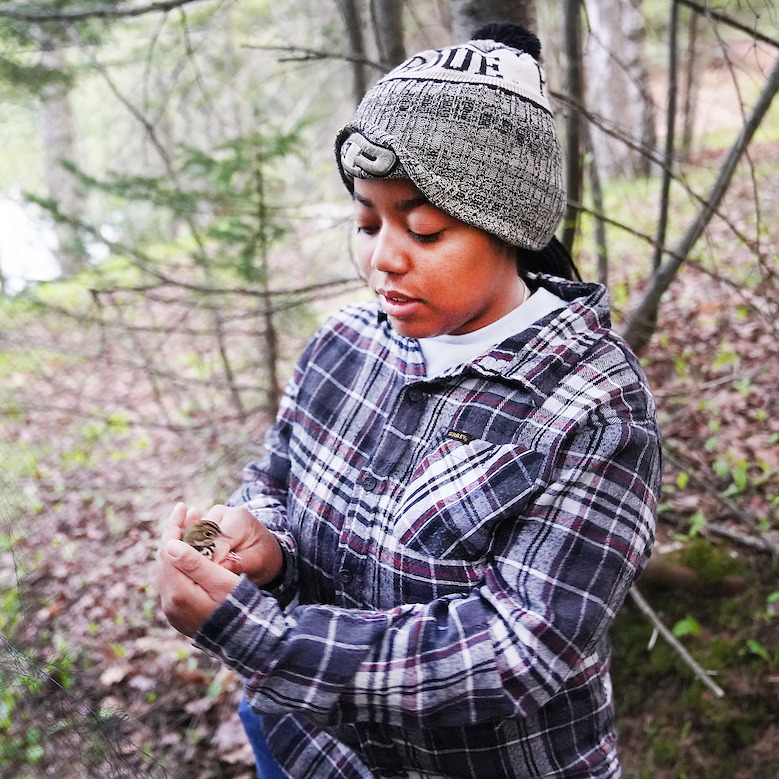 Student holding bird