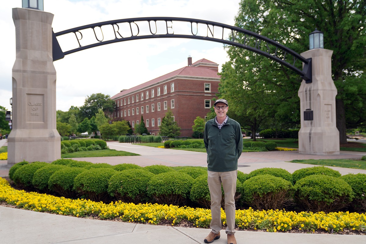 John Collier under the Gateway to the Future arch