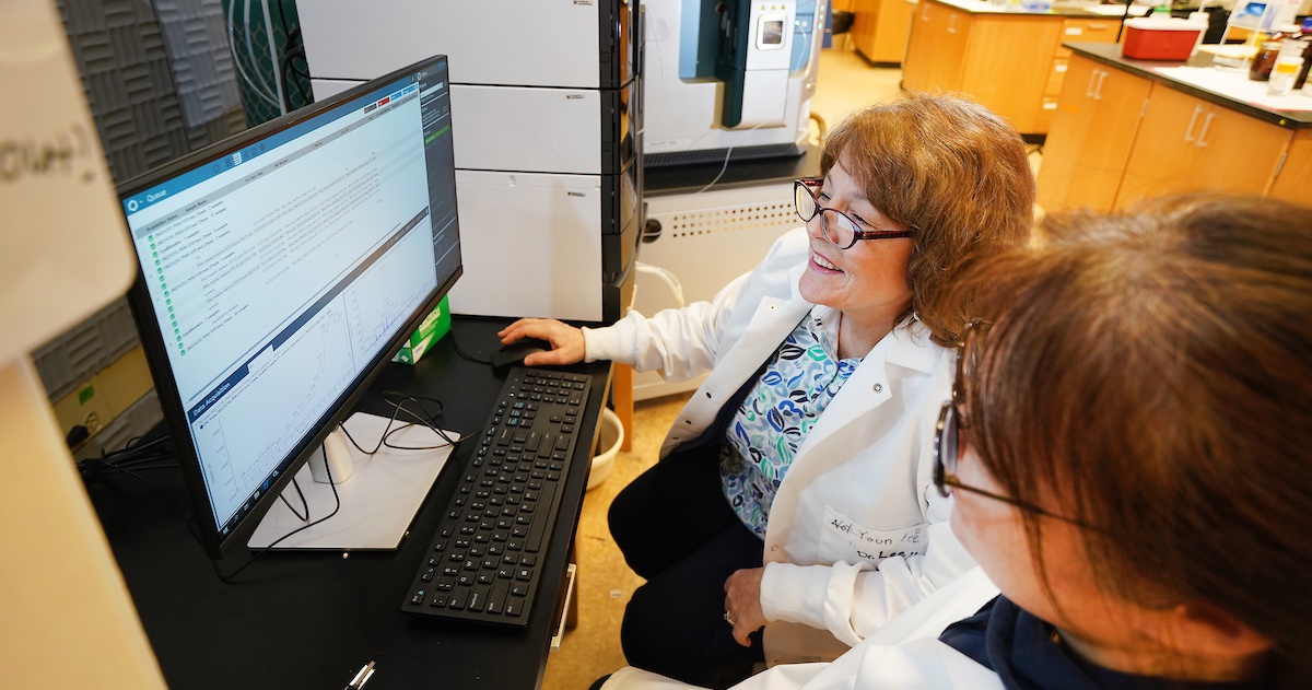 Linda lee looking at data on her computer