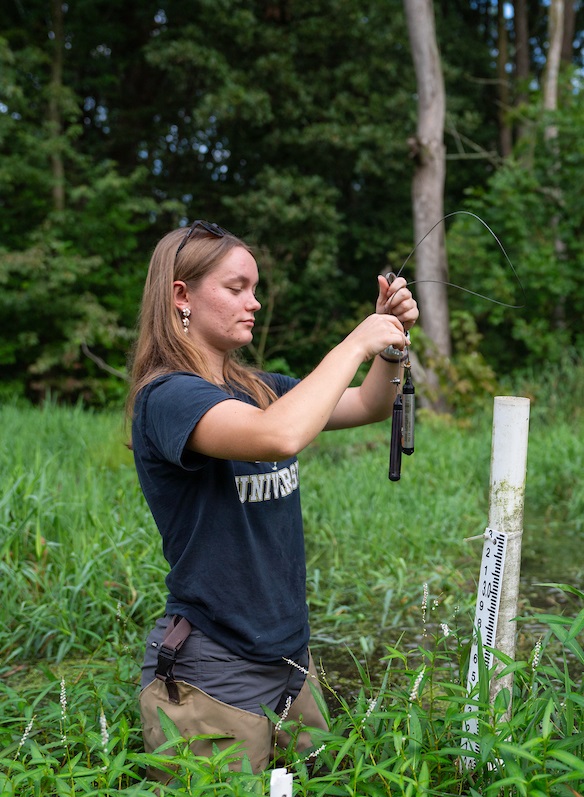 Alexus Arvin sampling water