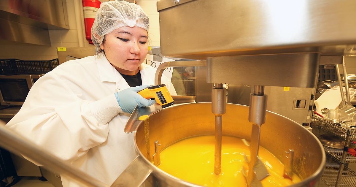 Student working on manufacturing food. 