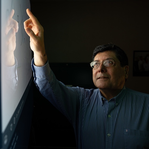 Carlos Corvalan, associate professor of food science and the project’s supervisor works on screen in lab at Purdue.
