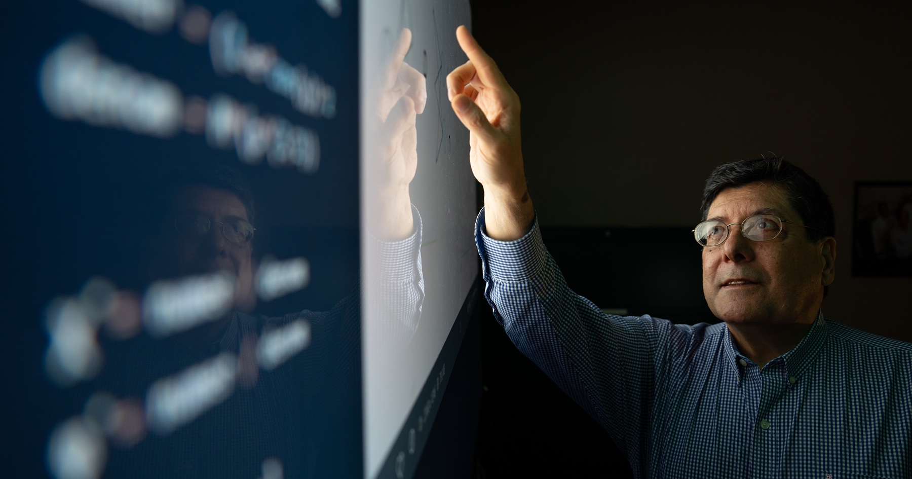 Carlos Corvalan, associate professor of food science and the project’s supervisor works on screen in lab at Purdue.