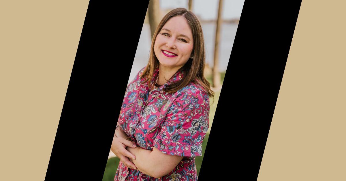 Headshot of Samantha Miller, new director of corporate business development, with a lake and trees in the background.