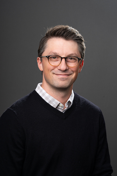 Portrait of Kyle Horton in front of a grey backdrop.