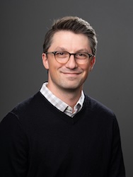 Portrait of Kyle Horton in front of grey backdrop.