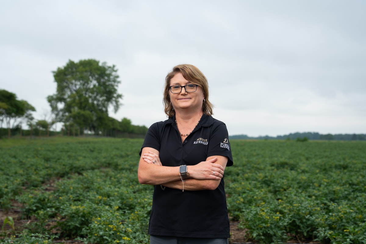 Amanda Deering stands in a field