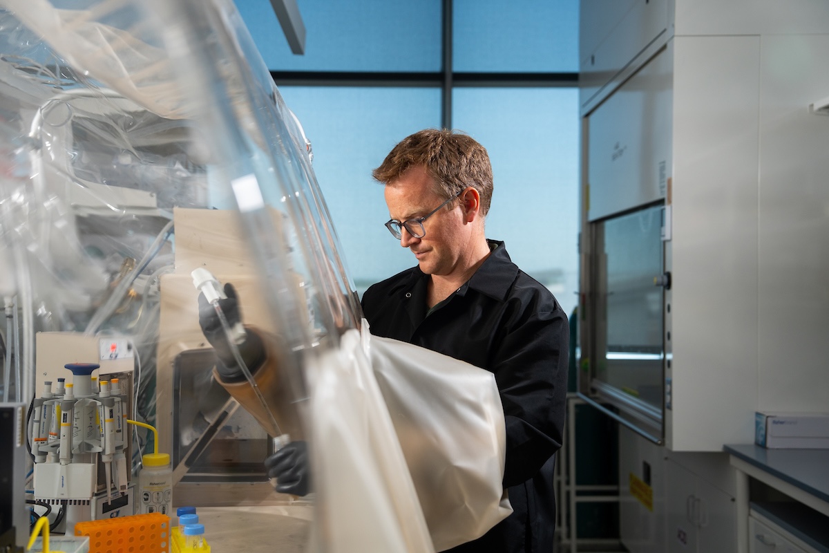 Man working in an anaerobic chamber