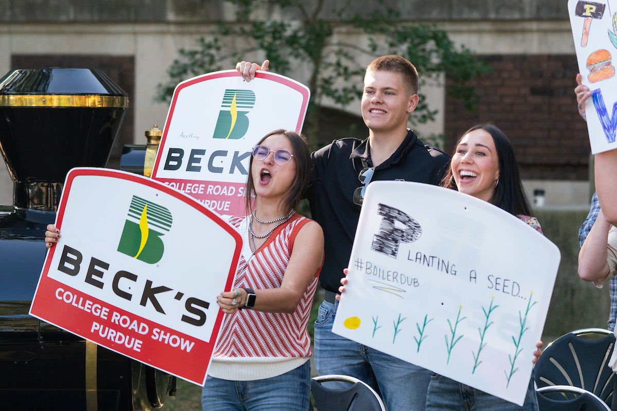 Students holding signs at the 2024 AgDay College Roadshow