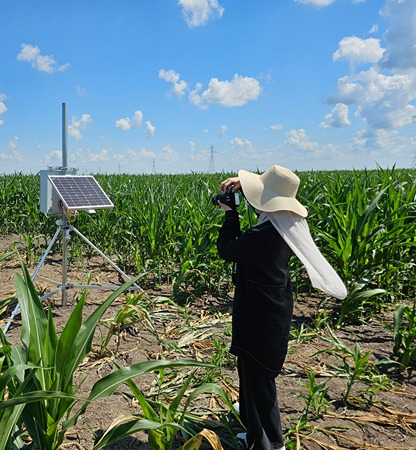 agbridge participant takes a picture of a spring unit