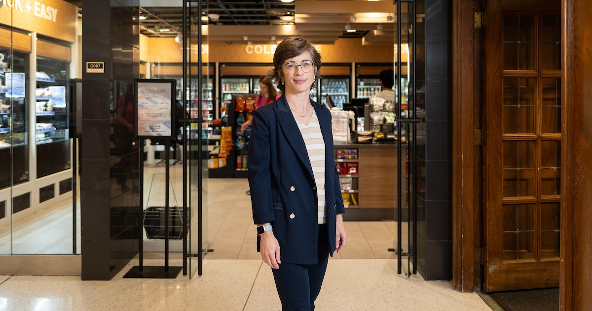 Ellen Van Loo standing in front of the entrance to the Boilermaker Market.