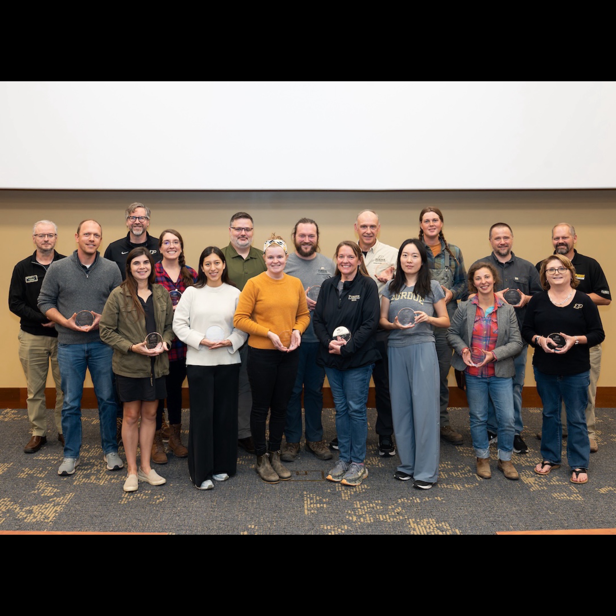 Members of the Purdue Student Farm holding the TEAM Award.