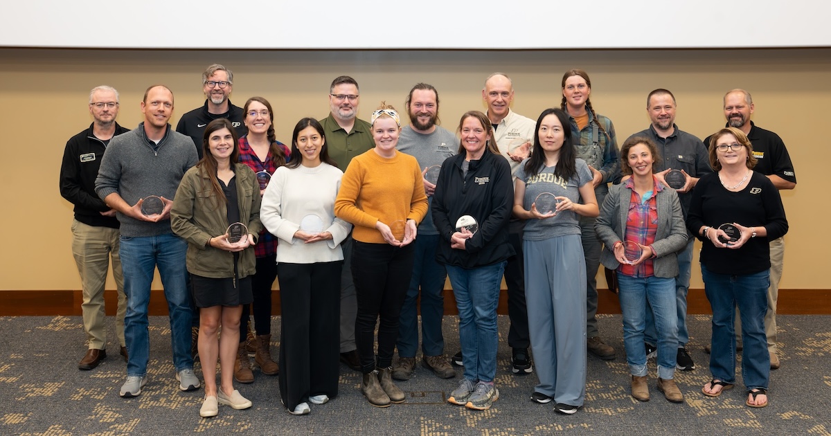 Members of the Purdue Student Farm holding the TEAM Award. 