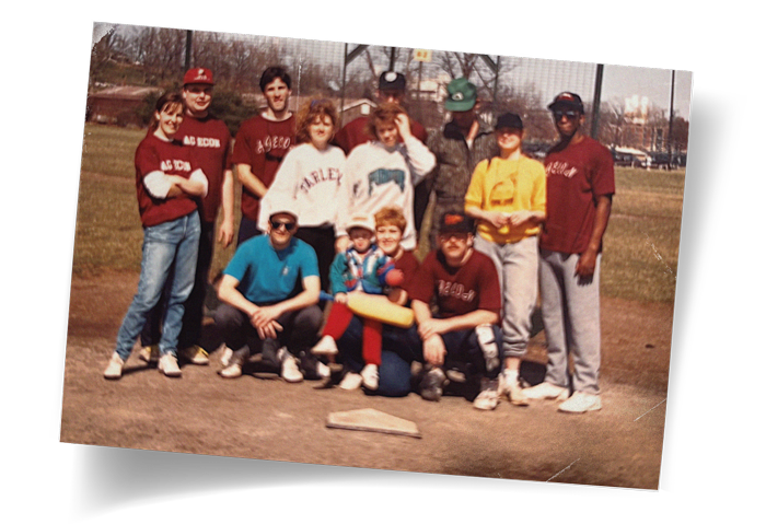 Sam and Kelly Williams are pictured with the agricultural economics intramural softball team from their time in graduate school.