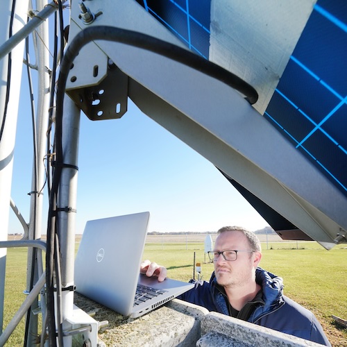 Austin Pearson servicing weather equipment.