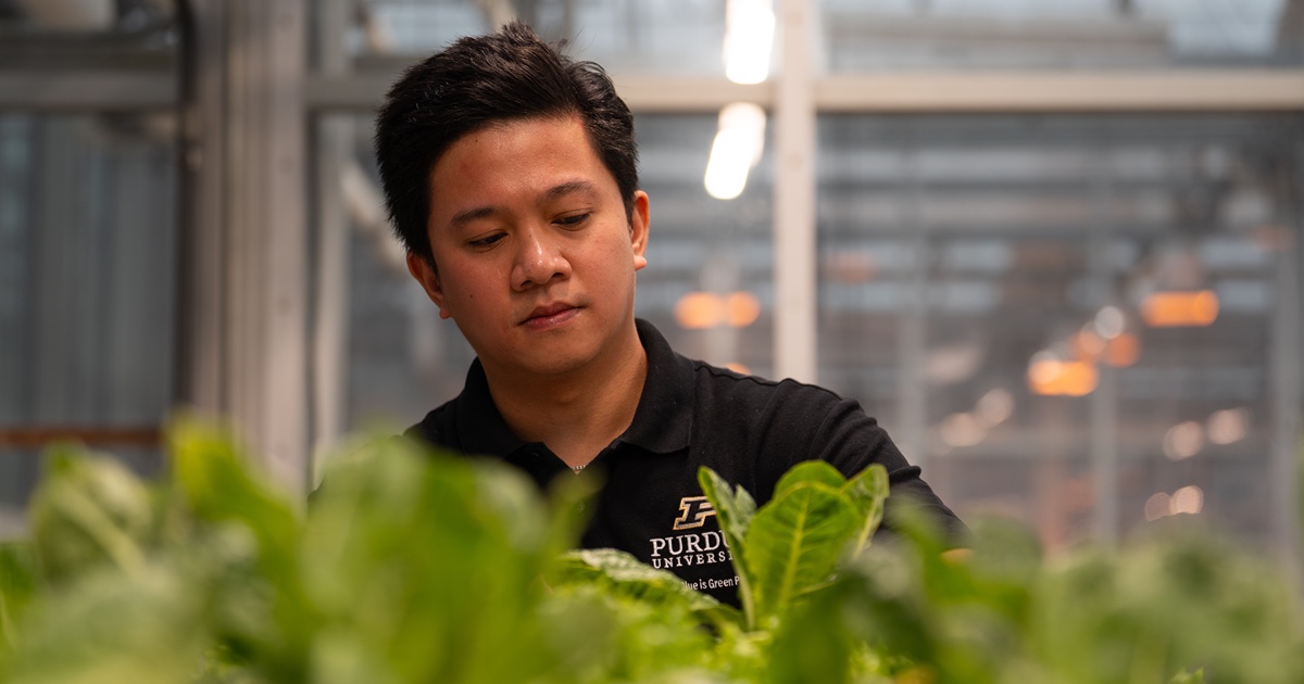 Jemuel Doctolero in green house.
