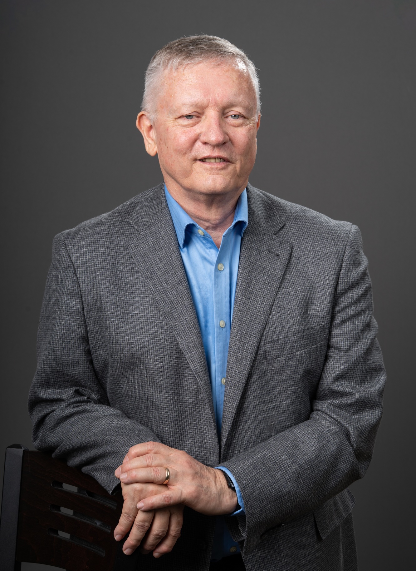 Image of Ron Turco in front of gray backdrop.