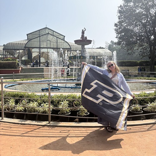 Abigail Bothwell holds Purdue flag on study ab